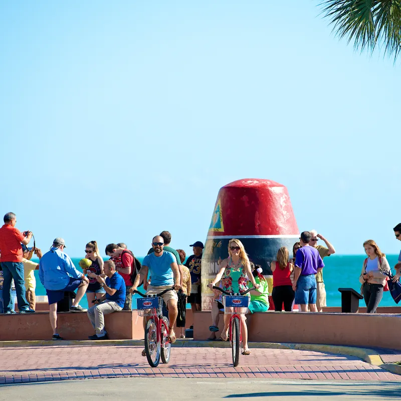 couple biking through key west
