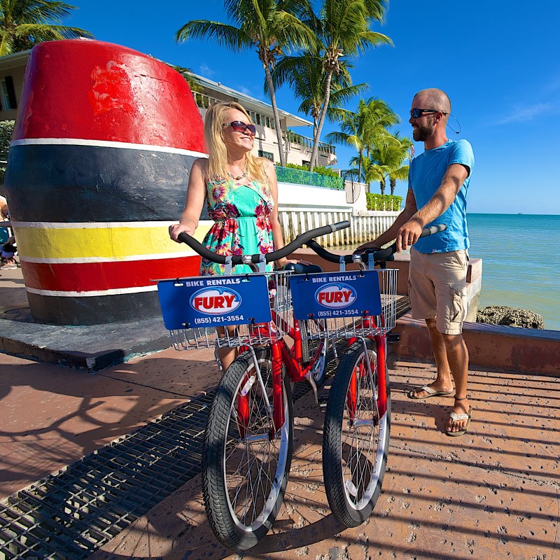 couple on dock with bikes